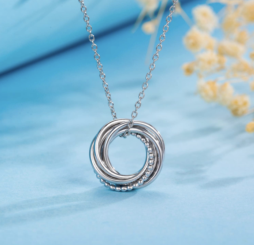 A sterling silver necklace with interlocking rings, one for each decade of the gift recipient’s life in recognition of their milestone birthday.