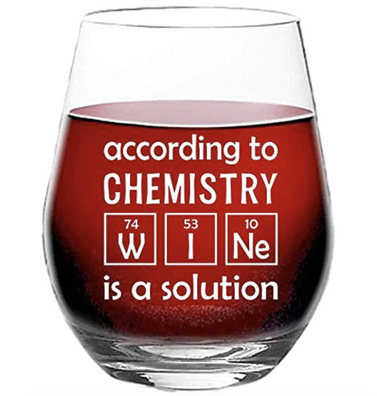 A stemless wine glass that says “according to chemistry, wine is a solution” - wine is spelled with the periodic table elements as a pun about chemistry and solutions!
