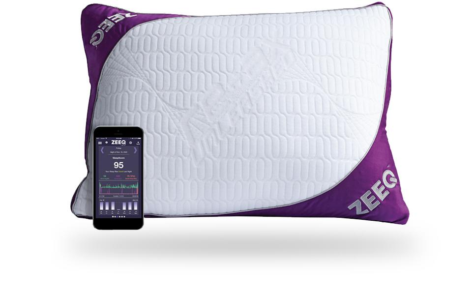 Picture of anti-snore smart pillow beside a smartphone