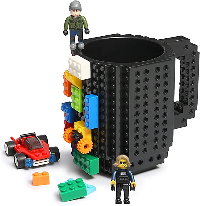 Image of a black mug usable for hot or cold beverages, BPA-free, with the ability to connect lego bricks all around the outside of it