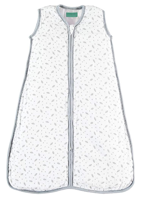 A grey and white sleep sack with a tiny pattern of leaves and triangles